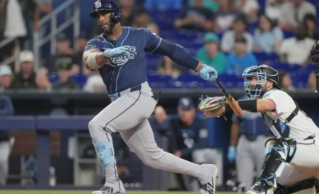 Tampa Bay Rays' Yandy Díaz strikes out during the first inning of a baseball game against the Miami Marlins Saturday, June 6, 2026, in Miami. (AP Photo/Marta Lavandier)