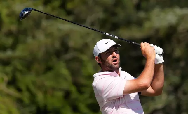 Scottie Scheffler watches his tee shot on the sixth hole during the final round of the U.S. Open golf tournament at Shinnecock Hills Golf Club in Southampton, N.Y., Sunday, June 21, 2026. (AP Photo/David J. Phillip)