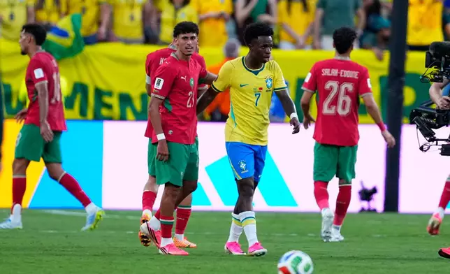 Brazil's Vinicius Junior, right, greats Morocco's Ayoub Amaimouni at the end of the World Cup Group C soccer match between Brazil and Morocco in East Rutherford, N.J., near New York, Saturday, June 13, 2026. (AP Photo/Petr David Josek)