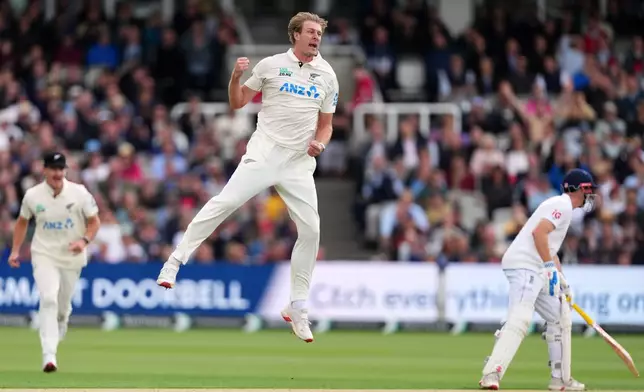 New Zealand's Kyle Jamieson celebrates taking the wicket of England's Jamie Smith during the first day of the test match between England and New Zealand at Lord's cricket ground in London, Thursday, June 4, 2026. (AP Photo/Kirsty Wigglesworth)