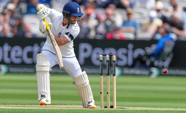 England's Ben Duckett plays a shot off the bowling of New Zealand's Matt Henry during the first day of their test match at Lord's cricket ground in London, Thursday, June 4, 2026. (AP Photo/Kirsty Wigglesworth)
