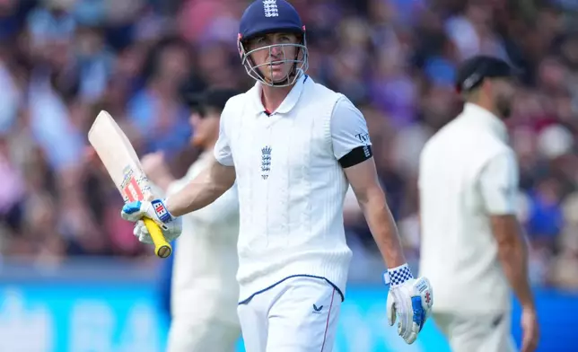 England's Harry Brook leaves the pitch after losing his wicket during the first day of the test match between England and New Zealand at Lord's cricket ground in London, Thursday, June 4, 2026. (AP Photo/Kirsty Wigglesworth)