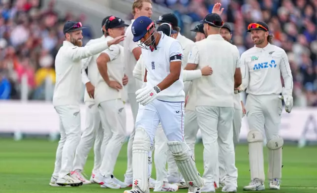 England's Emilio Gay leaves the pitch after he is caught off a ball bowled by New Zealand's Kyle Jamieson during the first day of their test match at Lord's cricket ground in London, Thursday, June 4, 2026. (AP Photo/Kirsty Wigglesworth)