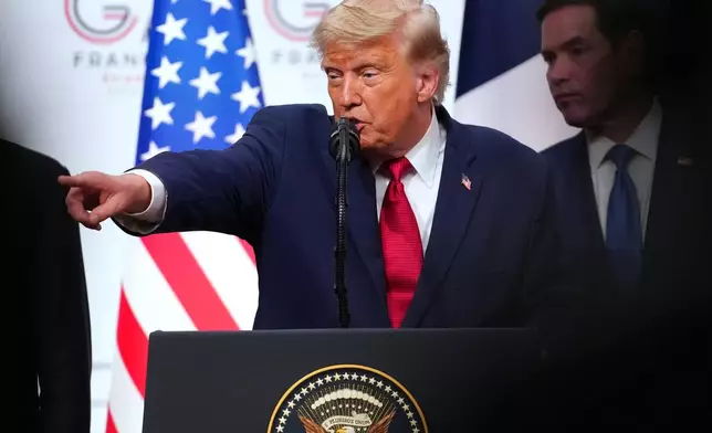 U.S. President Donald Trump, center, takes questions during a media conference at the end of the G7 summit in Evian-les-Bains, France, Wednesday, June 17, 2026. (AP Photo/Vadim Ghirda)