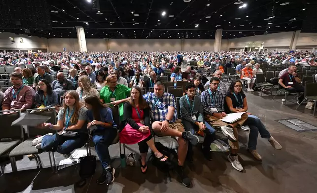 Attendees listen as presentations are discussed during the annual meeting of the Southern Baptist Convention, Tuesday, June 9, 2026, in Orlando, Fla. (AP Photo/Phelan M. Ebenhack)