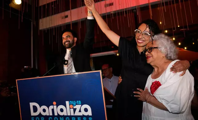 New York City Mayor Zohran Mamdani celebrates with Democratic congressional candidate Darializa Avila Chevalier and organizer Carmen Rojas during an election night watch party Tuesday, June 23, 2026, in New York. (AP Photo/Seth Wenig)