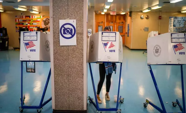 A voter casts a ballot during New York's primary election on Tuesday, June 23, 2026, in New York. (AP Photo/Ryan Murphy)