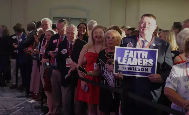 Supporters of South Carolina Attorney General Alan Wilson gather for his gubernatorial Election Night victory party, in Columbia, Tuesday, June 23, 2026. (AP Photo/Meg Kinnard)