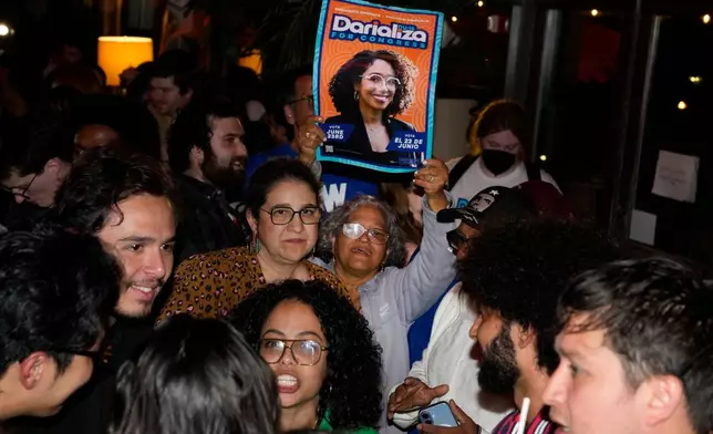 Supporters for Democratic congressional candidate Darializa Avila Chevalier celebrate during an election night watch party Tuesday, June 23, 2026, in New York. (AP Photo/Seth Wenig)