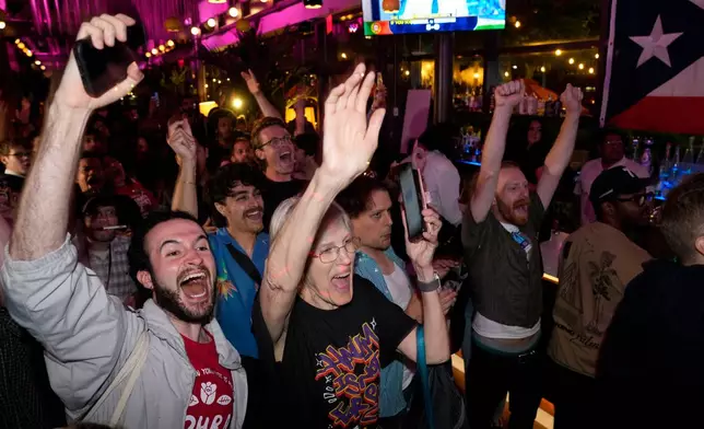 Supporters for Democratic congressional candidate Darializa Avila Chevalier celebrate during an election night watch party Tuesday, June 23, 2026, in New York. (AP Photo/Seth Wenig)