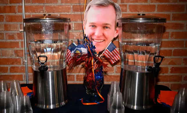A paper head of democratic congressional candidate Ben McAdams sits out during a watch party for Utah's primary election on Tuesday, June 23, 2026, in Salt Lake City. (AP Photo/Alex Goodlett)