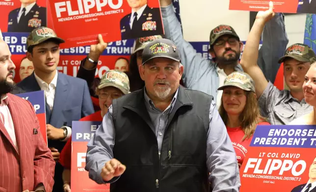 David Flippo, a Republican candidate for Congress in Nevada's 2nd district, speaks during a primary election night watch party Tuesday, June 9, 2026, in Reno, Nev. (AP Photo/William Hale Irwin)