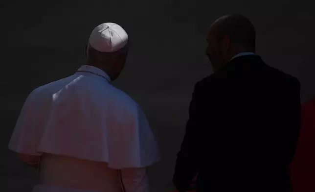 Pope Leo XIV, left, arrives at the Spanish parliament in Madrid, Spain, Monday, June 8, 2026. (AP Photo/Manu Fernandez)