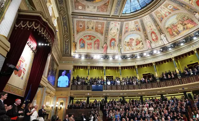 Pope Leo XIV is flanked by Francina Armengol, President of the Congress of Deputies of Spain, left, and Pedro Rollan Ojeda, President of the Senate of Spain, as he meets with members of the Spanish Parliament at the Congress of deputies, in Madrid, Monday, June 8, 2026. (AP Photo/Alessandra Tarantino)
