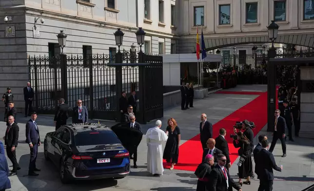 Pope Leo XIV is welcomed by the President of the Spanish Parliament Francina Armengol upon his arrival at the Spanish parliament in Madrid, Spain, Monday, June 8, 2026. (AP Photo/Manu Fernandez)