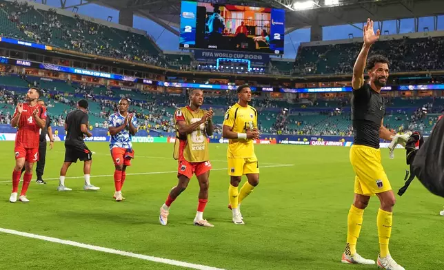 Cape Verde goalkeeper Vozinha, right, and teammates wave to supporters following the World Cup Group H soccer match between Uruguay and Cape Verde in Miami Gardens, Fla., Sunday, June 21, 2026. (AP Photo/Rebecca Blackwell)