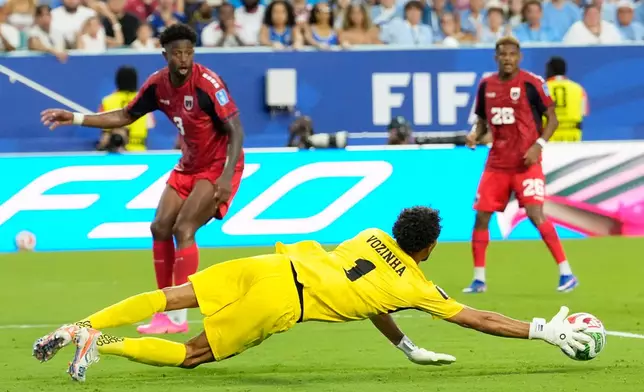 Cape Verde goalkeeper Vozinha (1) dive stopped take the ball during the World Cup Group H soccer match between Uruguay and Cape Verde in Miami Gardens, Fla., Sunday, June 21, 2026. (AP Photo/Rebecca Blackwell)