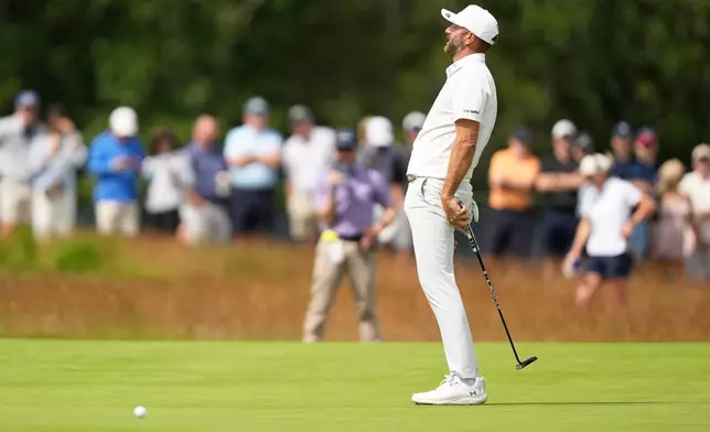 Dustin Johnson reacts after missing a putt during the second round of the U.S. Open golf tournament at Shinnecock Hills Golf Club in Southampton, N.Y., Friday, June 19, 2026.(AP Photo/Gerald Herbert)