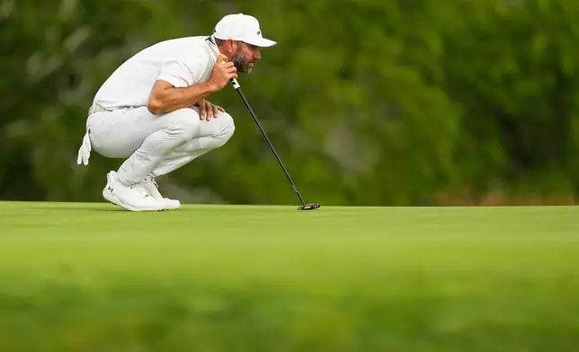 Dustin Johnson lines up a putt on the second hole during the second round of the U.S. Open golf tournament at Shinnecock Hills Golf Club in Southampton, N.Y., Friday, June 19, 2026.(AP Photo/Gerald Herbert)