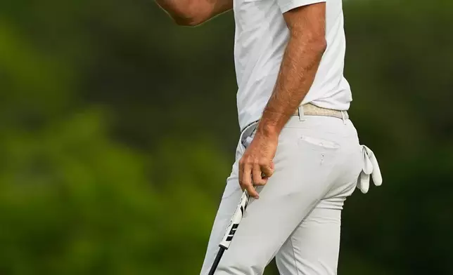 Dustin Johnson waves after his putt on the second hole during the second round of the U.S. Open golf tournament at Shinnecock Hills Golf Club in Southampton, N.Y., Friday, June 19, 2026.(AP Photo/Gerald Herbert)