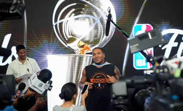 New York Knicks guard Miles McBride talks with the media before a workout prior to the start of the NBA Finals basketball series against the San Antonio Spurs, Tuesday, June 2, 2026, in San Antonio. (AP Photo/Eric Gay)