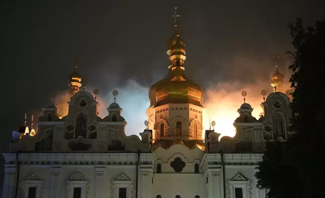 The roof of the Dormition Cathedral of the Kyiv-Pechersk Lavra is on fire during the overnight Russian attack on Kyiv, Ukraine Monday, June 15, 2026. (AP Photo/Danylo Antoniuk)