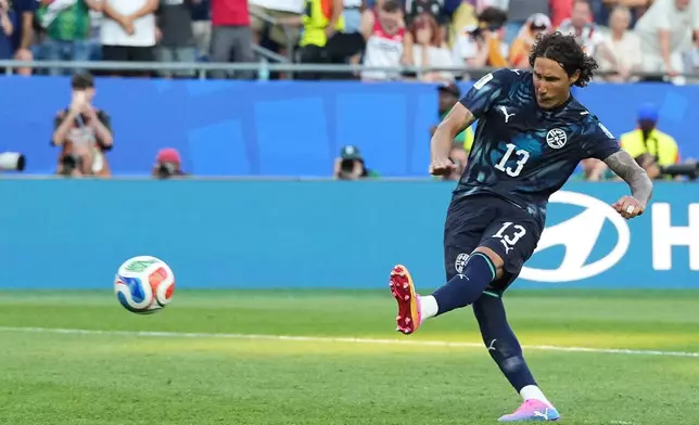 Paraguay's Jose Canale (13) scores a sudden death penalty goal to win the match during the World Cup round of 32 soccer match between Germany and Paraguay in Foxborough, Mass., near Boston, Monday, June 29, 2026. (AP Photo/Martin Meissner)