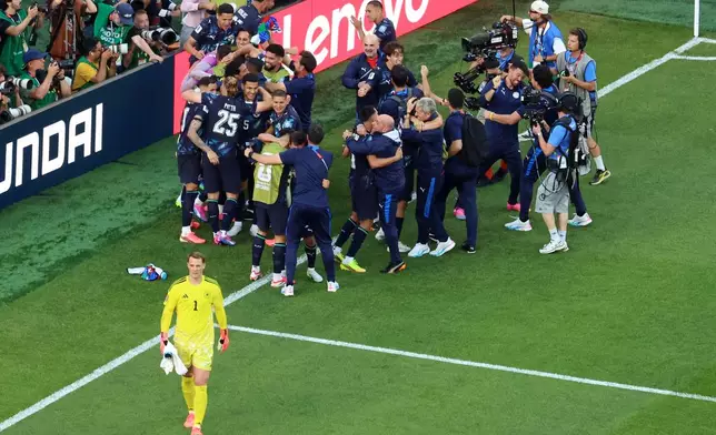 Germany goalkeeper Manuel Neuer (1) reacts as Paraguay players celebrate after a penalty shootout at the end of the World Cup round of 32 soccer match between Germany and Paraguay in Foxborough, Mass., near Boston, Monday, June 29, 2026. (AP Photo/Mark Stockwell)