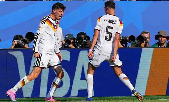 Germany's Kai Havertz (7) celebrates after scoring his side's opening goal with teammate Aleksandar Pavlovic (5) during the World Cup round of 32 soccer match between Germany and Paraguay in Foxborough, Mass., near Boston, Monday, June 29, 2026. (AP Photo/Martin Meissner)