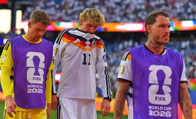 Germany's Nick Woltemade (11) walks off the field after losing to Paraguay in a shootout during the World Cup round of 32 soccer match in Foxborough, Mass., near Boston, Monday, June 29, 2026. (AP Photo/Steven Senne)