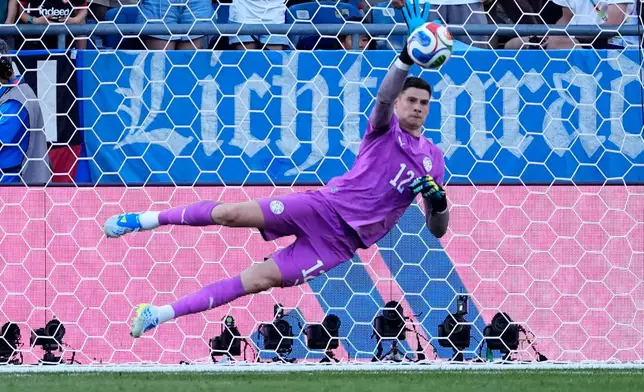 Paraguay goalkeeper Orlando Gill (12) makes a save during a penalty shootout at the end of during the World Cup round of 32 soccer match between Germany and Paraguay in Foxborough, Mass., near Boston, Monday, June 29, 2026. (AP Photo/Petr David Josek)