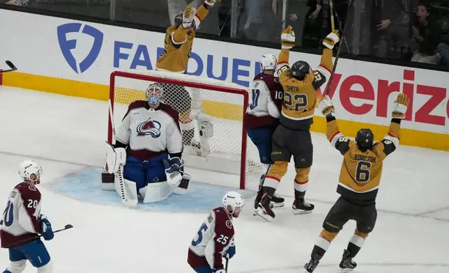 Vegas Golden Knights right wing Cole Smith (22) celebrates after scoring against the Colorado Avalanche during the third period in Game 4 of the Western Conference finals NHL hockey Stanley Cup playoff series Tuesday, May 26, 2026, in Las Vegas. (AP Photo/John Locher)