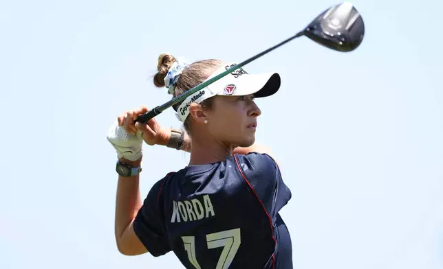 Nelly Korda, wearing a U.S soccer jersey, hits from the third tee during a practice round ahead of the U.S. Women's Open golf tournament Tuesday, June 2, 2026, in the Pacific Palisades area of Los Angeles. (AP Photo/Jessie Alcheh)