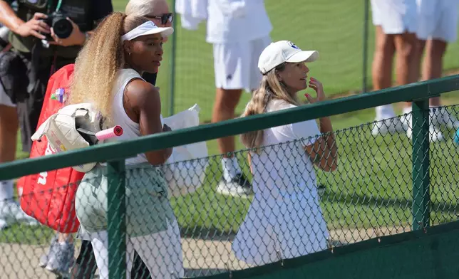 Serena Williams of the United States, left, arrives to practice one day ahead of the start of the Wimbledon Tennis Championships in London, Sunday, June 28, 2026. (AP Photo/Kin Cheung)