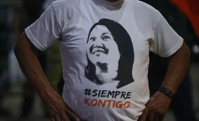 A supporter of presidential candidate Keiko Fujimori of the Popular Force party wears a shirt with her image on it during a campaign rally in Huacho, Peru, Tuesday, June 2, 2026. (AP Photo/Guadalupe Pardo)