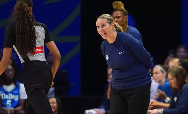 Minnesota Lynx head coach Cheryl Reeve, right, questions a call during the second half of a WNBA basketball game against the Dallas Wings in Arlington, Texas, Sunday, June 28, 2026. (AP Photo/LM Otero)