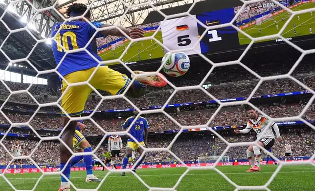 Germany's Deniz Undav (26), right, scores his side's sixth goal during the World Cup Group E soccer match between Germany and Curacao in Houston, Sunday, June 14, 2026. (AP Photo/Eric Gay)