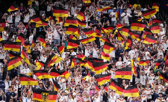 Germany fans wave flags on the stands before the start of the World Cup Group E soccer match between Germany and Curacao in Houston, Sunday, June 14, 2026. (AP Photo/Karen Warren)
