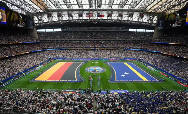 Flags are displayed on the field for the national anthem during the World Cup Group E soccer match between Germany and Curacao in Houston, Sunday, June 14, 2026. (AP Photo/Eric Smith)