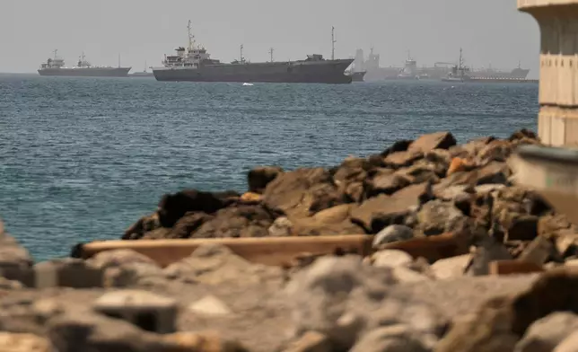 Tankers and cargo vessels are seen in the Gulf of Oman, along shipping routes linking the Strait of Hormuz and the Arabian Sea, Tuesday, June 16, 2026. (AP Photo)