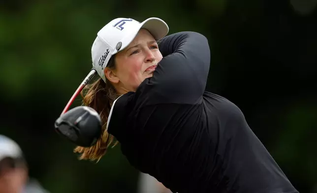 Lottie Woad, of England, watches her tee shot on the fourth hole during the first round of the Meijer LPGA Classic golf tournament, Thursday, June 18, 2026, in Belmont, Mich. (AP Photo/Al Goldis)