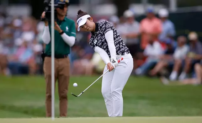 Miyu Yamashita, of Japan, hits onto the 18th green during the final round of the Meijer LPGA Classic golf tournament, Sunday, June 21, 2026, in Belmont, Mich. (AP Photo/Al Goldis)