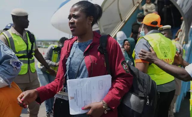 Nigerian nationals repatriated from South Africa, following concerns about unrest, arrive at the Murtala Muhammed International Airport in Lagos, Nigeria, Thursday, June 11, 2026. (AP Photo/Sunday Alamba)
