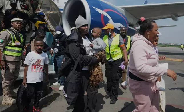 Nigerian nationals repatriated from South Africa arrive at the Murtala Muhammed International Airport in Lagos, Nigeria, Thursday, June 11, 2026. (AP Photo/Sunday Alamba)