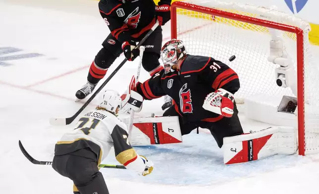 Vegas Golden Knights' William Karlsson (71) scores a goal past Carolina Hurricanes' Frederik Andersen (31) during the second period of Game 1 of the NHL hockey Stanley Cup Final series in Raleigh, N.C., Tuesday, June 2, 2026. (AP Photo/Ben McKeown)