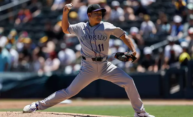 Colorado Rockies starting pitcher Tomoyuki Sugano throws during the first inning of a baseball game against the Athletics, Sunday, June 14, 2026, in Las Vegas. (AP Photo/Caroline Brehman)