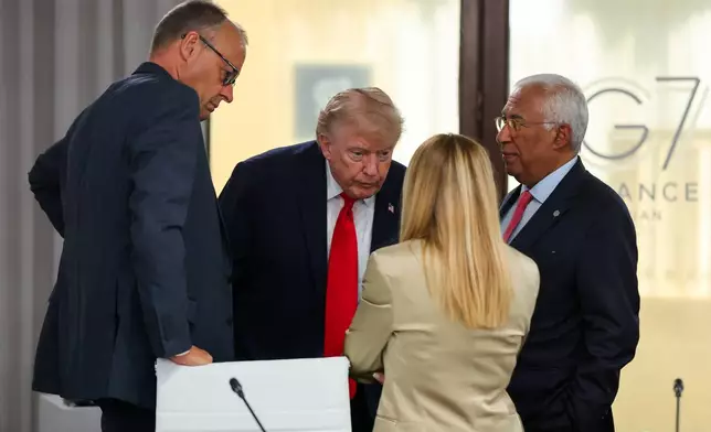President Donald Trump, Germany's Chancellor Friedrich Merz, European Council President Antonio Costa and Italy's Prime Minister Giorgia Meloni attend a working lunch with leaders of G7 and the Middle East in Evian-les-Bains, France, Tuesday, June 16, 2026. (Christian Hartmann/Pool Photo via AP)