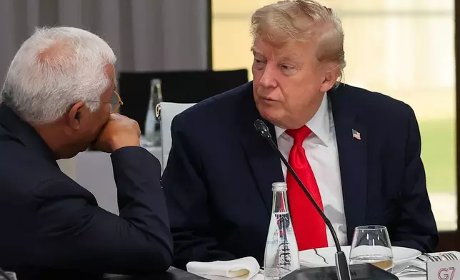President Donald Trump listens to European Council President Antonio Costa, left, at a working lunch with leaders of G7 and the Middle East in Evian-les-Bains, France, Tuesday, June 16, 2026. (Christian Hartmann/Pool Photo via AP)
