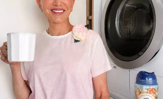 Fashion designer Cynthia Rowley, wearing her limited-edition Downy Boutique Botanicals brooch alongside the collection that inspired it.