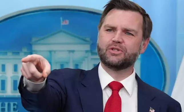 Vice President JD Vance points as he takes questions from reporters in the James Brady Press Briefing Room at the White House, Thursday, June 18, 2026, in Washington. (AP Photo/Jacquelyn Martin)